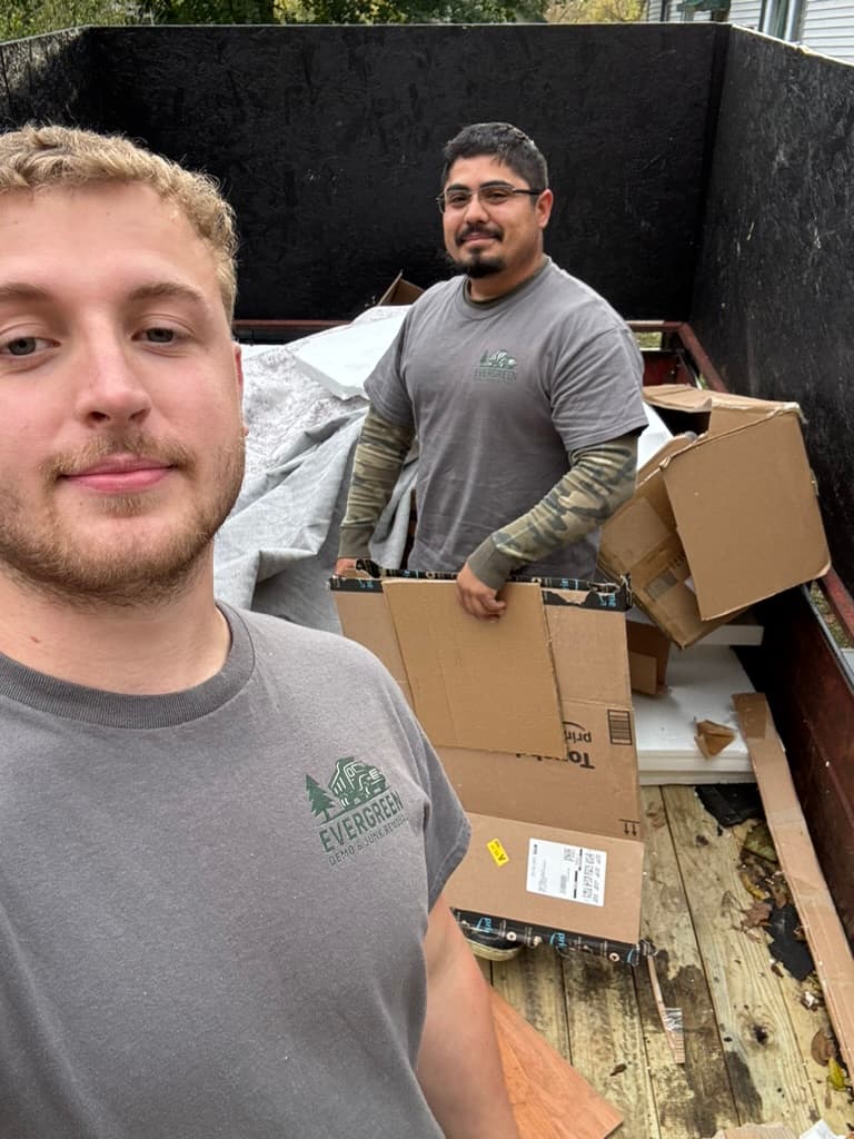 Evergreen crew loading junk items into trailer during Lake County junk removal job